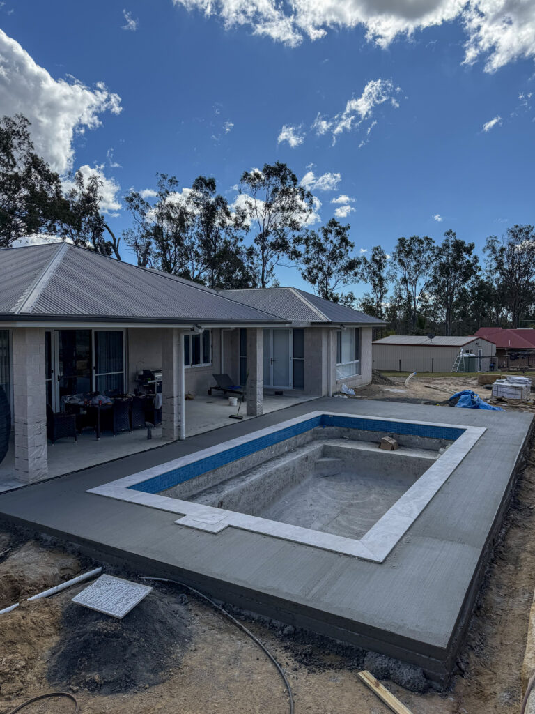 Concrete pool surround under construction at a Gold Coast home