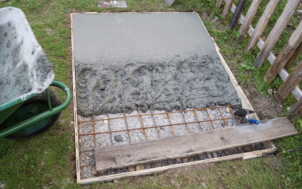 Backyard concrete slab with steel mesh and formwork before the pour