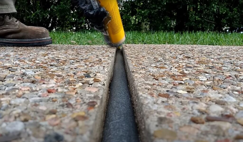 Expansion joint cut into an exposed aggregate concrete driveway