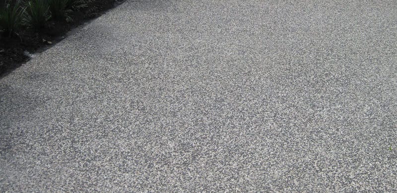 Close up of exposed aggregate concrete surface texture