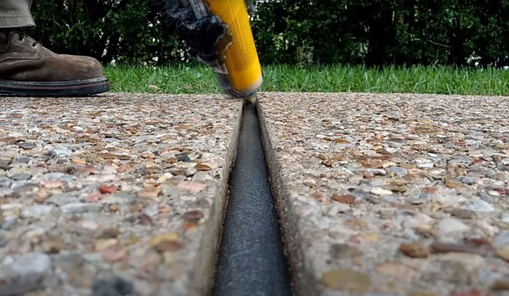 Exposed aggregate concrete driveway with expansion joints