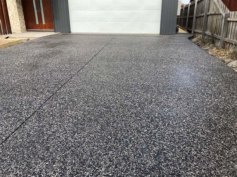 Exposed aggregate concrete driveway on a Gold Coast home