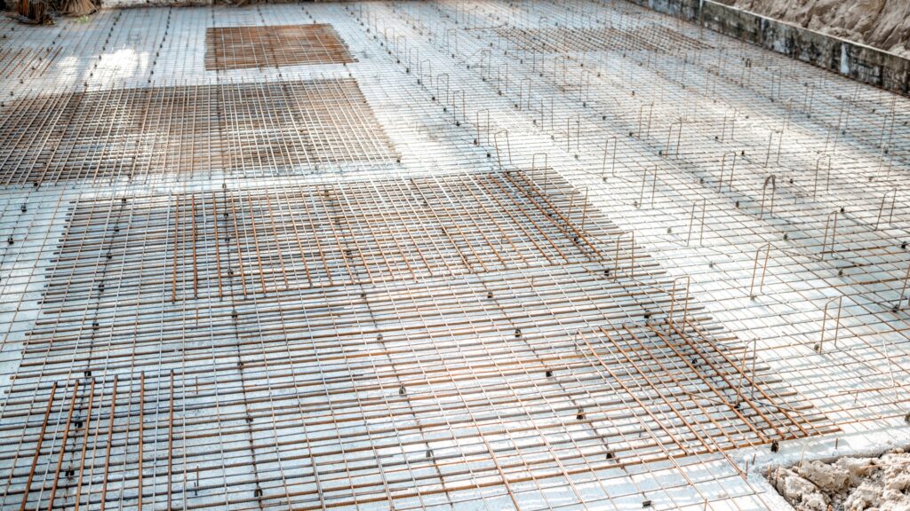 Steel reinforcement mesh set out for a house slab