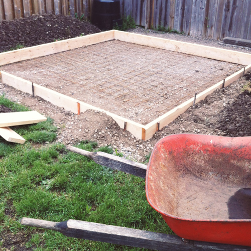 Small shed slab formwork with concrete pump hose in place